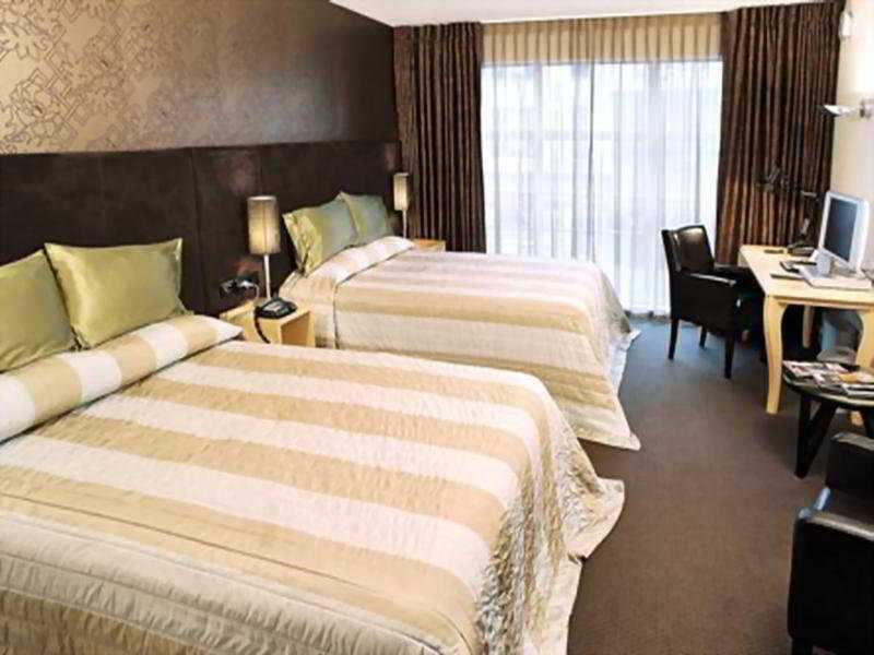 คิวที เวลลิงตัน อพาร์ตเมนต์ Hotel ภายนอก รูปภาพ A typical room at the hotel